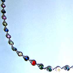 Platinum bezel set necklace with multi-colored round sapphires
