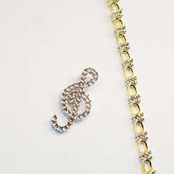 G-Clef Pendant in platinum and 2 tone bracelet